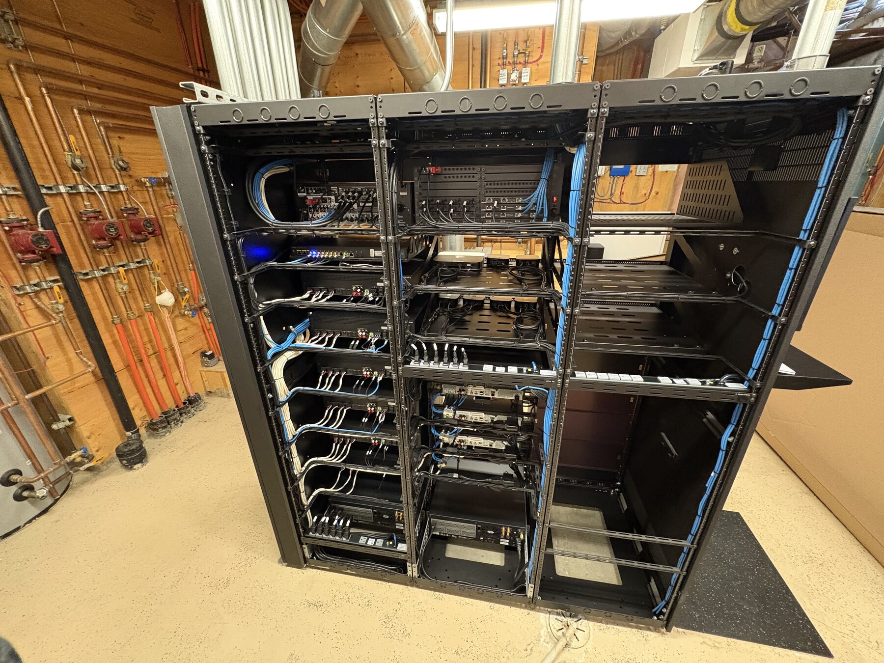 Triple-bay open equipment rack with structured wiring
